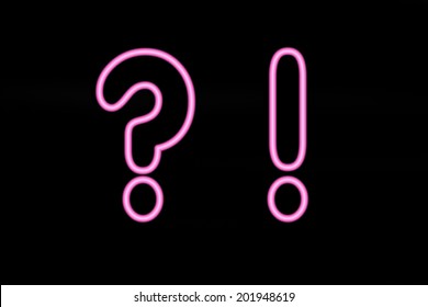 Pink neon signs on black background