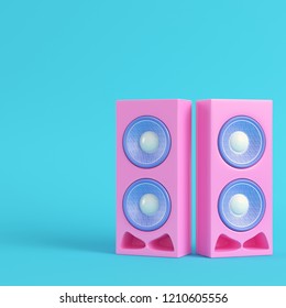 Pink stereo speakers on bright blue background in pastel colors. Minimalism concept. 3d render