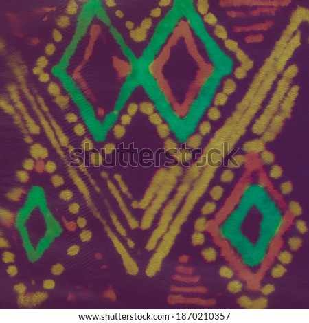 Pink and turquoise ethnic ikat pattern on a dark violet background. Handmade watercolor modern batik shawl design. Brightly artistic ethnic hand drawn tie dye pattern.