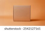 Plain, brown cardboard box sits on a solid orange background. Cardboard box for product mockup packaging and advertising a product