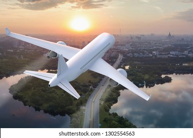 Plane taking off on the background of the city at sunset - 3d render