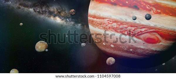 planet Jupiter with some of the 69 known moons with\
the Milky Way galaxy (3d space illustration, elements of this image\
are furnished by\
NASA)
