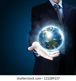 Planet System in Your Hand. Conceptual Image. Elements of this image furnished by NASA.