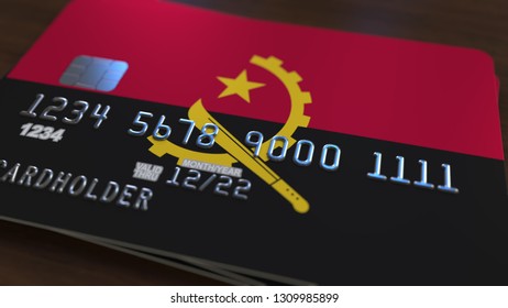 Plastic Bank Card Featuring Flag Of Angola. Angolan National Banking System Related 3D Rendering