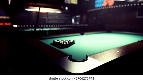 A pool table is arranged with colored balls ready for play in a cozy bar. The atmosphere is enhanced by soft lighting and a vibrant backdrop that adds character.