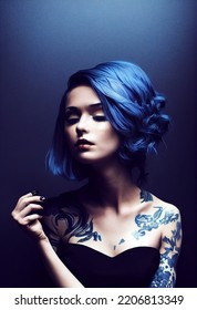 Portrait Of A Beautiful Girl With Blue Hair Not Looking At The Camera Isolated On Background