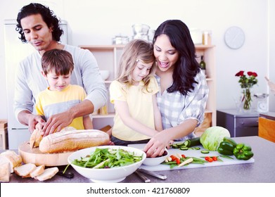 Positive family preparing lunch together in the kitchen - Powered by Shutterstock