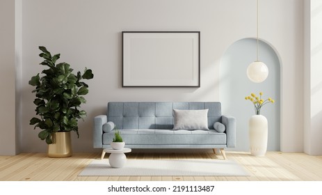 Poster frame mock up with blue sofa and decor in living room.3D rendering