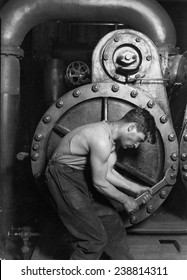 Power House Mechanic Working On Steam Pump. Photo By Lewis Hine, 1920.