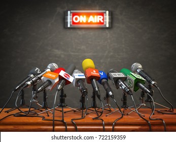 Press conference or interview on air.  Microphones of different mass media, radio, tv and press prepared for conference meeting. 3d illustration.