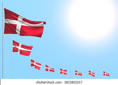 pretty holiday flag 3d illustration - many Denmark flags placed diagonal on blue sky with space for your text