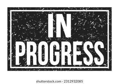 IN PROGRESS, words written on black rectangle stamp sign