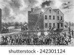 A Pro-slavery mob burning down the building housing the newspaper of abolitionist Elijah Parish Lovejoy (1802- 1837) on November 7, 1837.