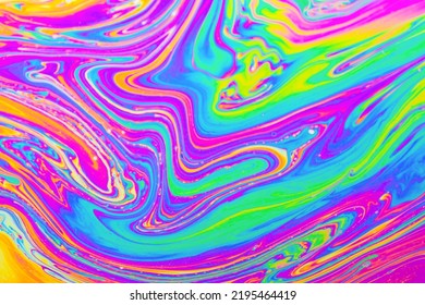 Psychedelic multicolored background abstract. Rainbow colors. patterns background. Photo macro shot of soap bubbles - Powered by Shutterstock - Get 15% off with code: PIKWIZARD15