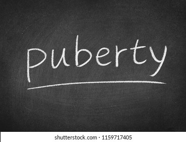 Puberty Concept Word On A Blackboard Background