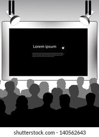 public in a hall in front of the screen