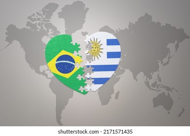 puzzle heart with the national flag of brazil and uruguay on a world map background.Concept. 3D illustration