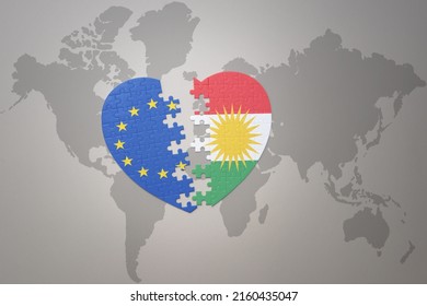 puzzle heart with the national flag of european union and kurdistan on a world map background. Concept. 3D illustration