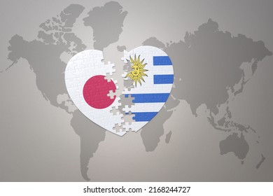 puzzle heart with the national flag of japan and uruguay on a world map background. Concept. 3D illustration