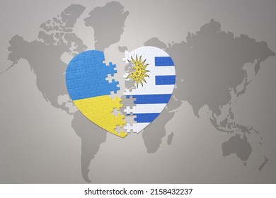 puzzle heart with the national flag of ukraine and uruguay on a world map background. Concept. 3D illustration