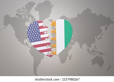 puzzle heart with the national flag of united states of america and cote divoire on a world map background. Concept. 3D illustration
