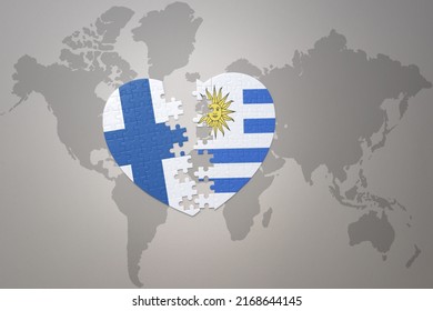 puzzle heart with the national flag of uruguay and finland on a world map background. Concept. 3D illustration