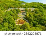 Pyatigorsk, Russia. Watercolor illustration. A flower bed with a staircase and the Academic Gallery is an elegant building from the mid-19th century. Aerial view