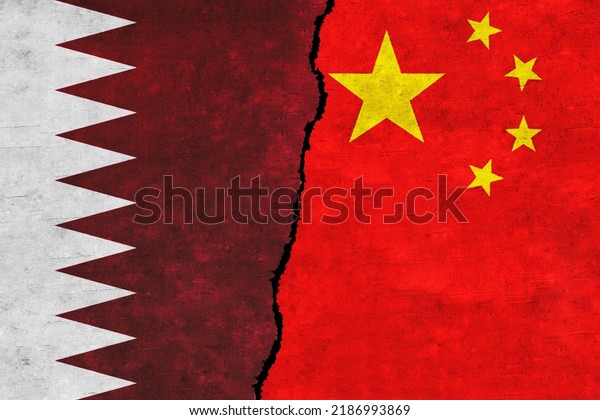 Qatar and China\
painted flags on a wall with a crack. Qatar and China relations.\
Qatar and China flags\
together