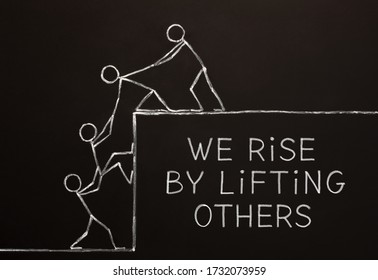 Quote We Rise By Lifting Others handdrawn on altruism, kindness, unselfishness, or teamwork concept drawn with chalk on blackboard. 