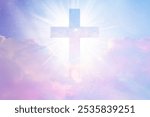 Radiant cross in a pastel sky with clouds, symbolizing faith and spirituality. The cross shines brightly, emphasizing hope and divine presence in the sky. Christian cross in sky, heaven background.