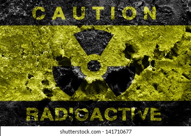Radioactive sign on old rusty metal barrel