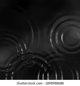 Rain Drops Ripples With Sun Shine. Raindrops On Water. Water Ripples In Metallic Color. Abstract Water Ripples. Ripple In Lake. 3D Illustration 3D Rendering. Black Water Texture.