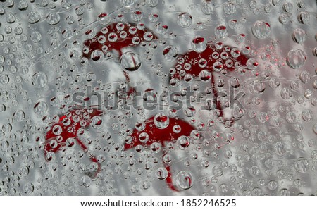 Similar – Drops on the window pane with reflection of the building opposite