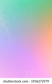 Rainbow Pastel Gradient  And A Combination Of Colors That Are Soft, Subtle And Harmonious  Of Beautiful Pink, Orange, Green, Yellow, Blue With Purple On The Background Of The Sky With Smooth Clouds.