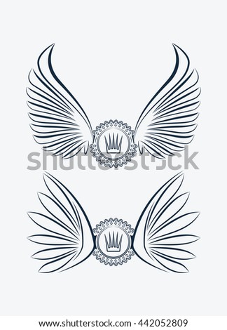 Raster copy of set of two outlined heraldic designs with wings and crown 