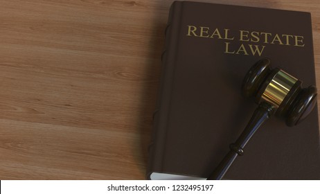 REAL ESTATE LAW Book And Judge Gavel. 3D Rendering