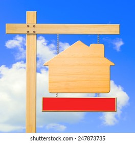 Real Estate Sign On Blue Sky, Clipping Path.