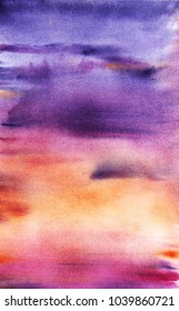 A real watercolor background of the sunset or the rising sky. purple pink orange. The sea horizon. Painted by hands.