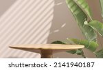 Realistic 3D render background for products overlay. Close up of round empty oak wood table with sunlight with tropical leaves plants. Organic beauty, Natural concept. Mock up, Podium, Spa, Sunscreen.