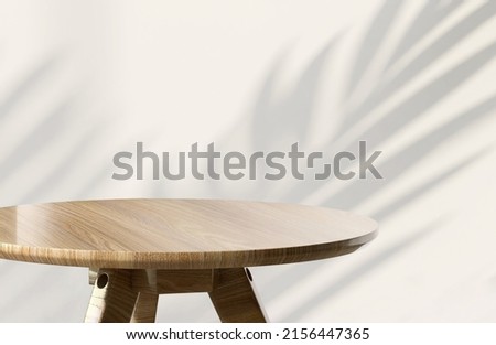 Realistic 3D render blank empty round teak wood table with tropical palm leaves shadow on white wall in background. Backdrop, Products overlay display, Templates, Beautiful wood grain, Summer, Natural