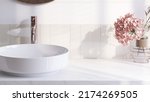 Realistic 3D render close up top view elegant bathroom vanity countertop with white ceramic wash basin and faucet, beautiful pink hydrangea. Morning sunlight, Blank space for beauty product display.