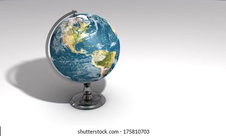 A realistic globe on a chrome pedestal over white featuring the western hemisphere. Some elements of this image furnished by NASA.