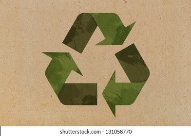 Recycle icon on cardboard  background closeup - Shutterstock ID 131058770