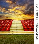 Red bleachers with sunset sky background