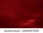 Red cloud texture background. Blurred photo of red sky with clouds. Photo can be used for galaxy space, New Year, Christmas and all celebrations backgrounds.