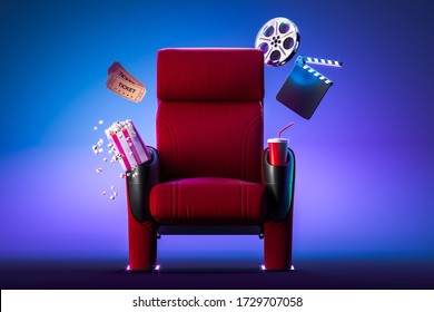Red Cozy Cinema Armchair With Comfortable Elbows Near Popcorn Bowl, Tickets, Film Reel And Movie Clapper. 3d Rendering