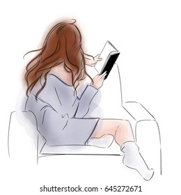 A Red Head Girl Sitting on Sofa Wearing Loose Sweater and Socks Reading Book