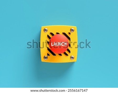 Red launch button is mounted on a yellow panel, suggesting the beginning of a new business, product, or service. 3d render.