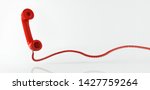Red retro telephone receiver flying in front of a white backdrop with copy space - 3d illustration
