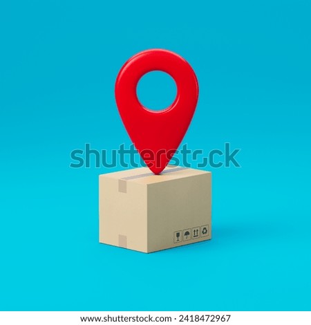 Red sign or geolocation marker placed over a cardboard box for goods delivery isolated on a blue background. Delivery sign or symbol. 3d render